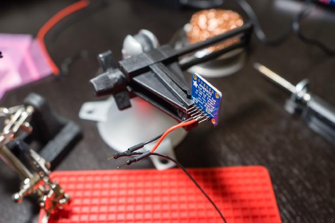 Soldering wires to the thermal sensor header.