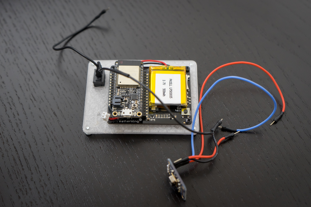 Huzzah32 Feather inserted into the 3.4” TFT Featherwing header. Notice pins soldered at the end of the wires.