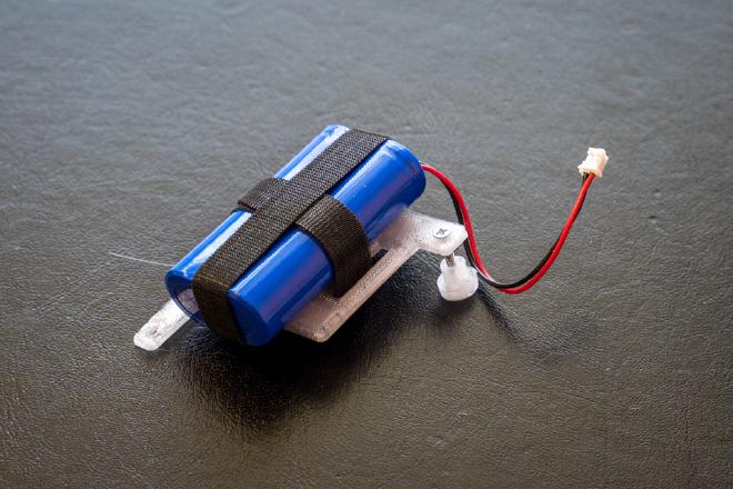 Battery and supporting frame